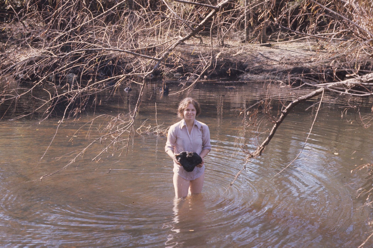 Diane pulling coral heads out of the river.